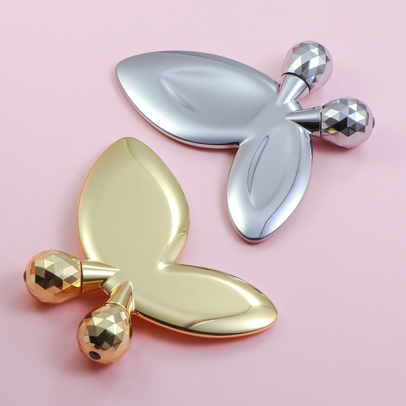 Rouleau de massage facial en forme de papillon en alliage de zinc